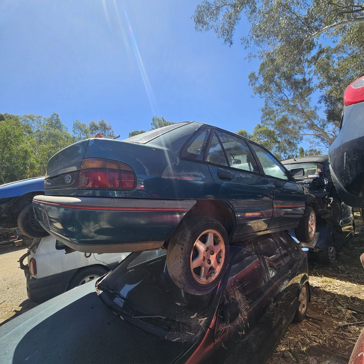 Ford Laser, Focus and Fiesta in the yard, photo 1 of 15