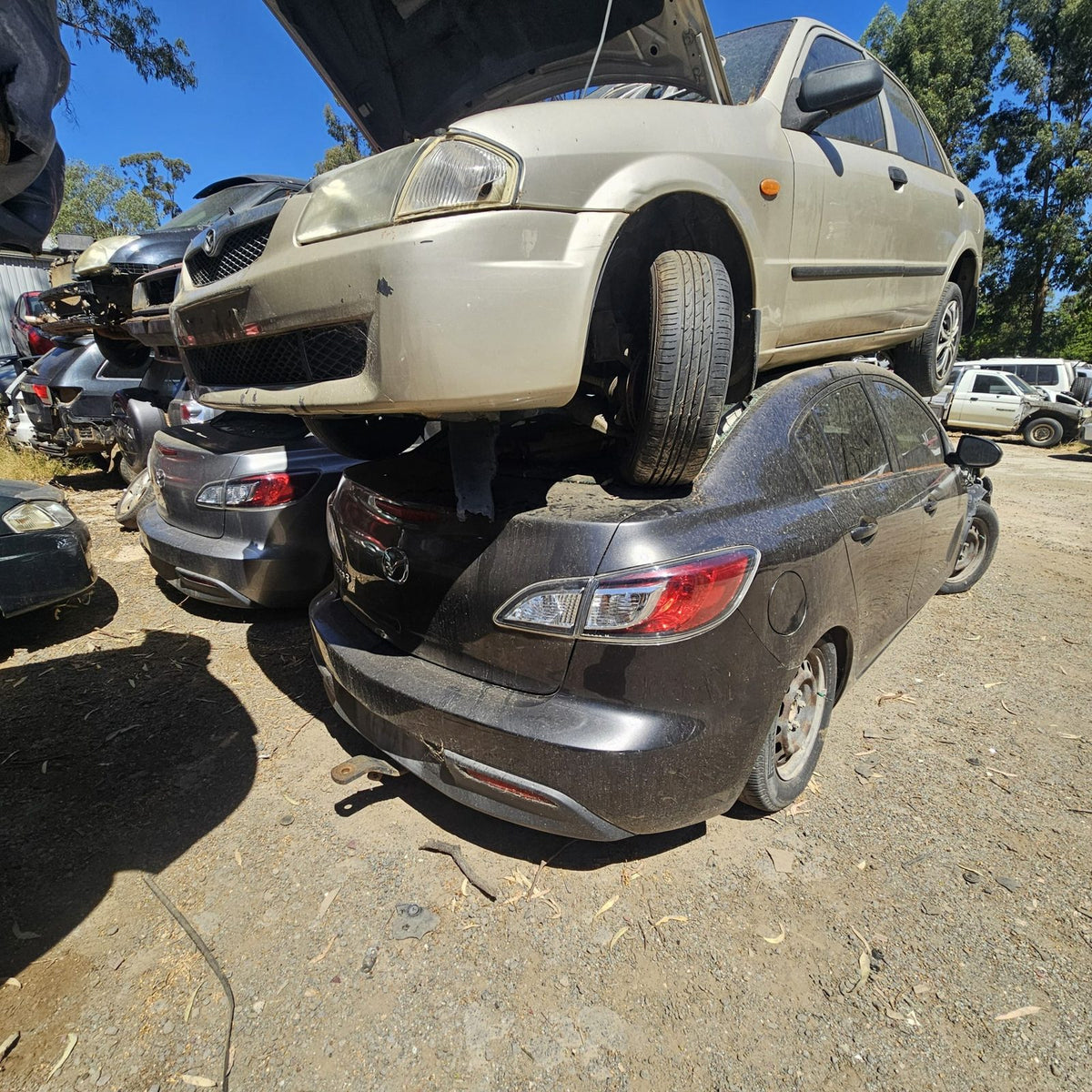 Mazda 2, 3, 6, 323 and CX-7 in the yard, photo 2 of 16