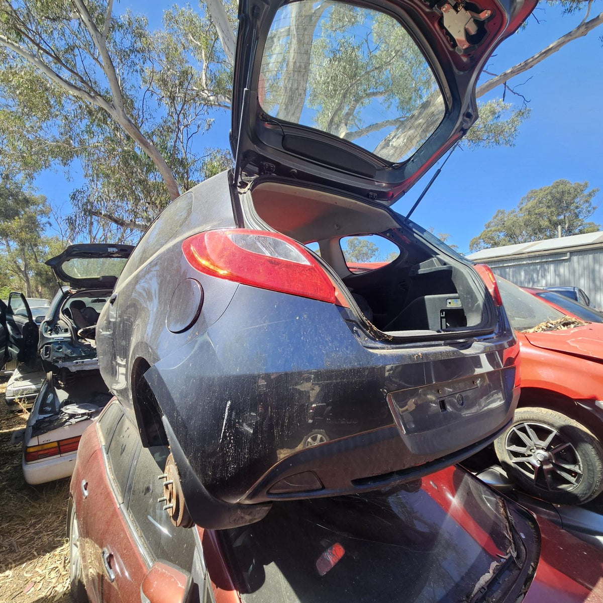 Mazda 2, 3, 6, 323 and CX-7 in the yard, photo 6 of 16