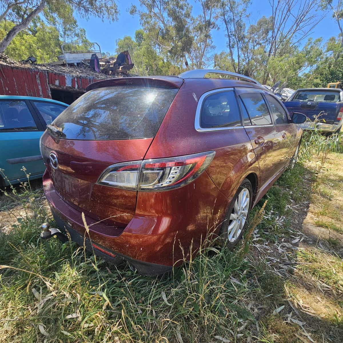 Mazda 2, 3, 6, 323 and CX-7 in the yard, photo 14 of 16