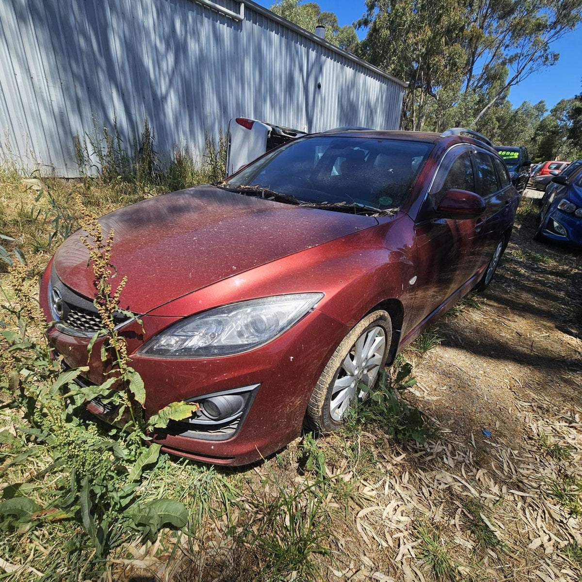 Mazda 2, 3, 6, 323 and CX-7 in the yard, photo 15 of 16