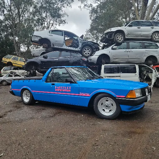 The Harcourt Auto Wreckers ute in the yard