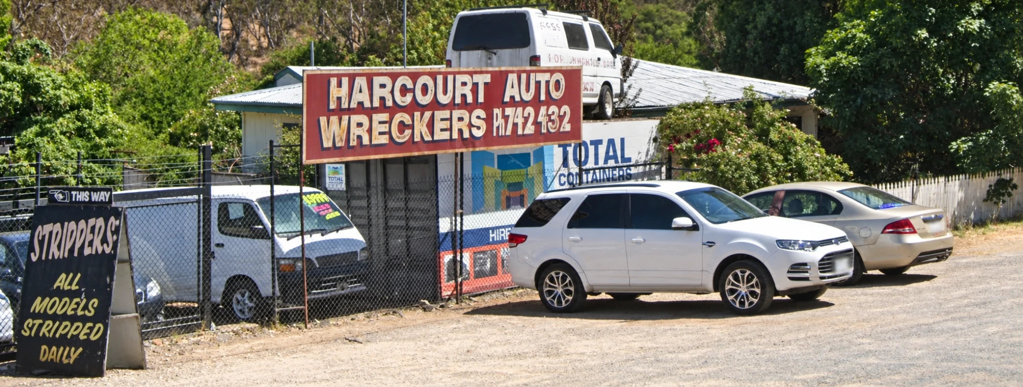 Cars being dismantled in the yard at Harcourt Auto Wreckers